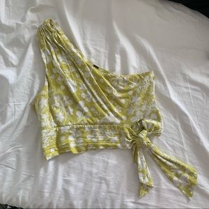 Free people tank top. One shoulder. Tie detail at the bottom. Size small